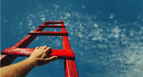 Picture of someone climbing a red ladder.